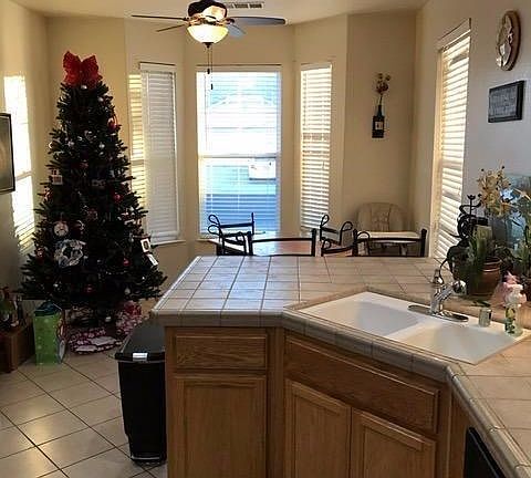 The casual dining area with a bay window overlooks the front yard...