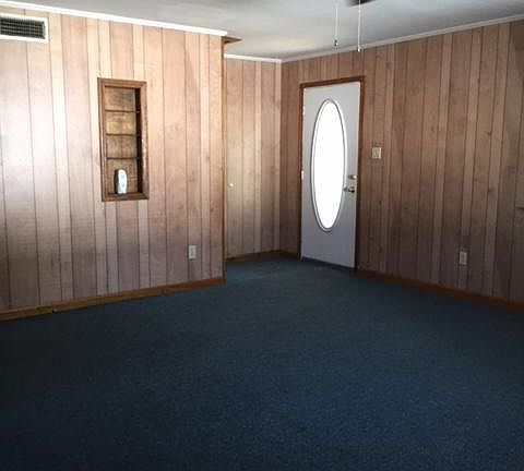 Front entrance door and view of large living room