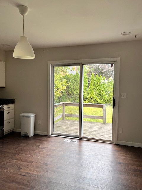 sliders from kitchen to private deck and back yard