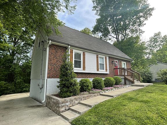 Concrete driveway and plenty of parking in back