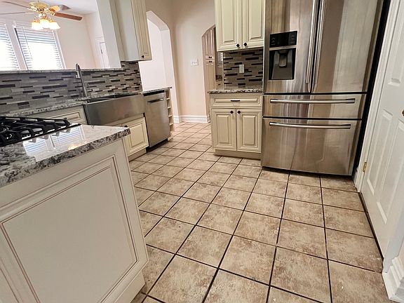 All new Kitchen with granite counter tops open to breakfast nook. French Door, extra drawer stainless refrigerator. Bosh Dishwasher. 
Farm Stainless Sink.