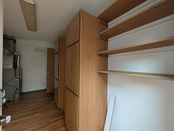 Extra shelving and storage in laundry room.