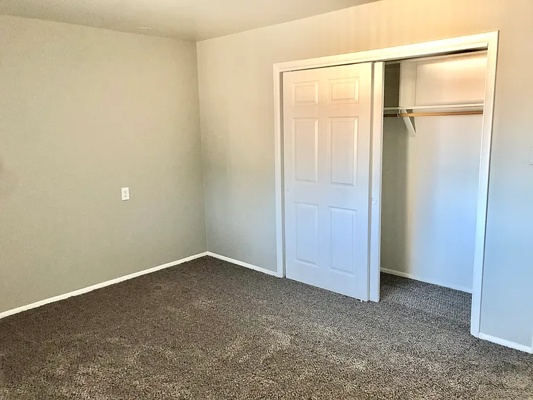 Step into a warm bedroom with ample closet space and cozy carpeting. Step into a warm bedroom with ample closet space and cozy carpeting.