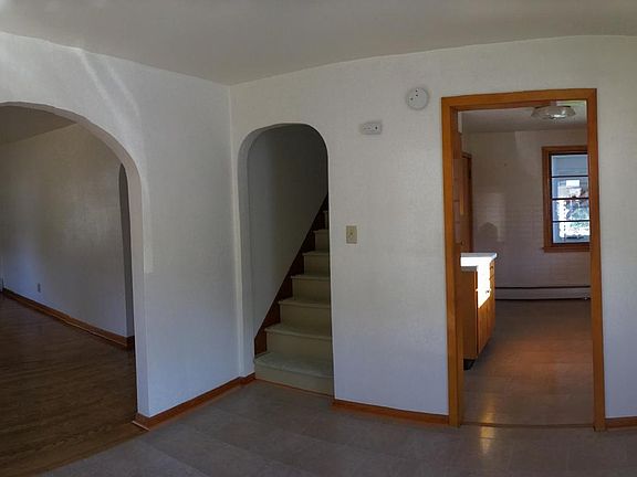 View from dining room to kitchen and to upstairs 2 bedrooms