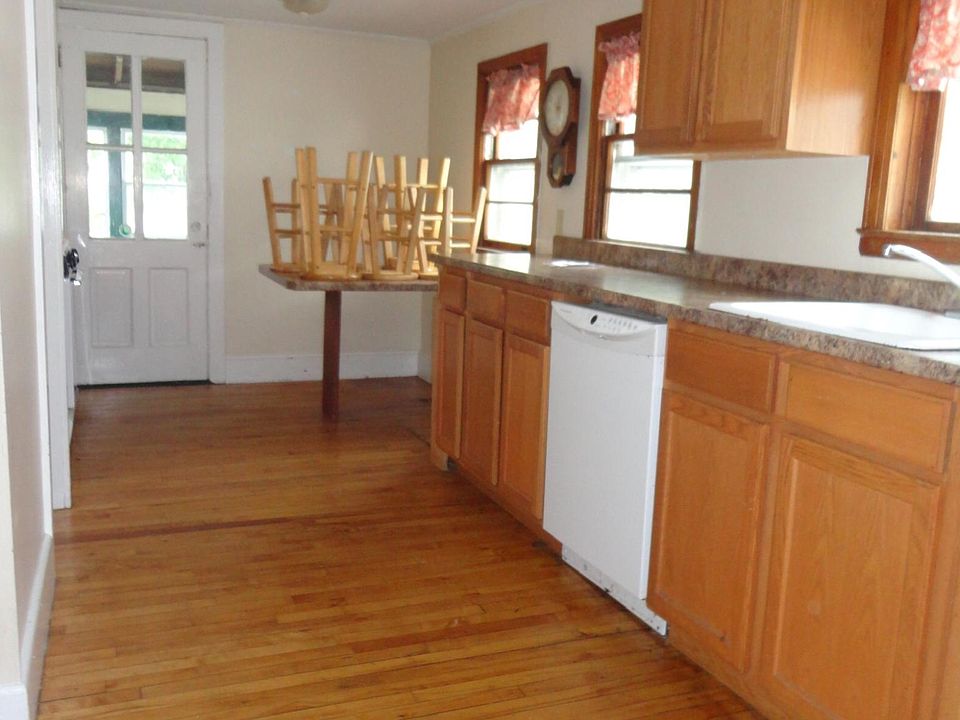 Kitchen from back hall towards small screened porch and BR #4