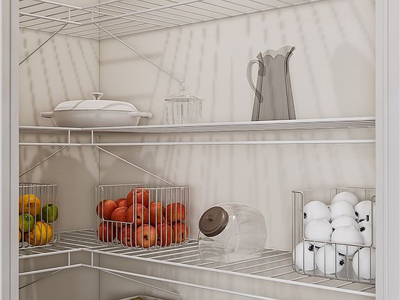 A well-organized refrigerator interior with various food items, containers, and kitchen utensils nea