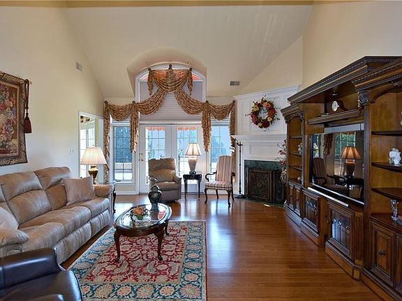 Great Room:  Hardwood flooring, cathedral ceiling, expensive window/door system.