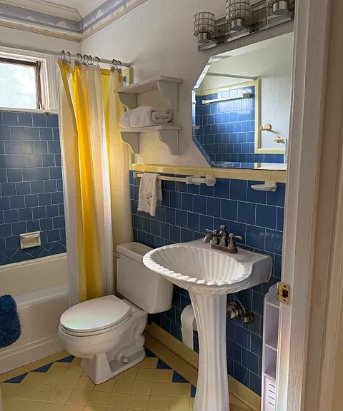 bathroom off central hallway features tub/shower