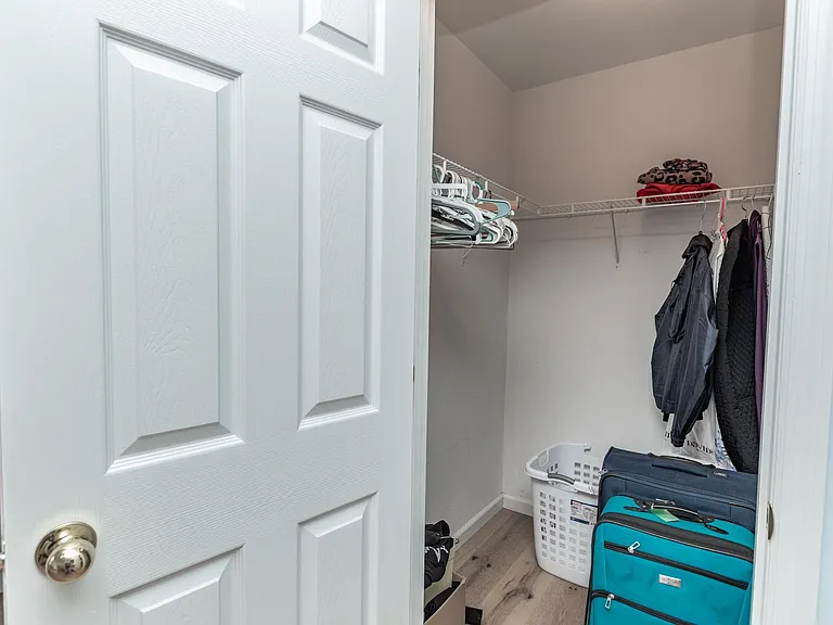 All bedrooms have walk in closets with overhead lighting