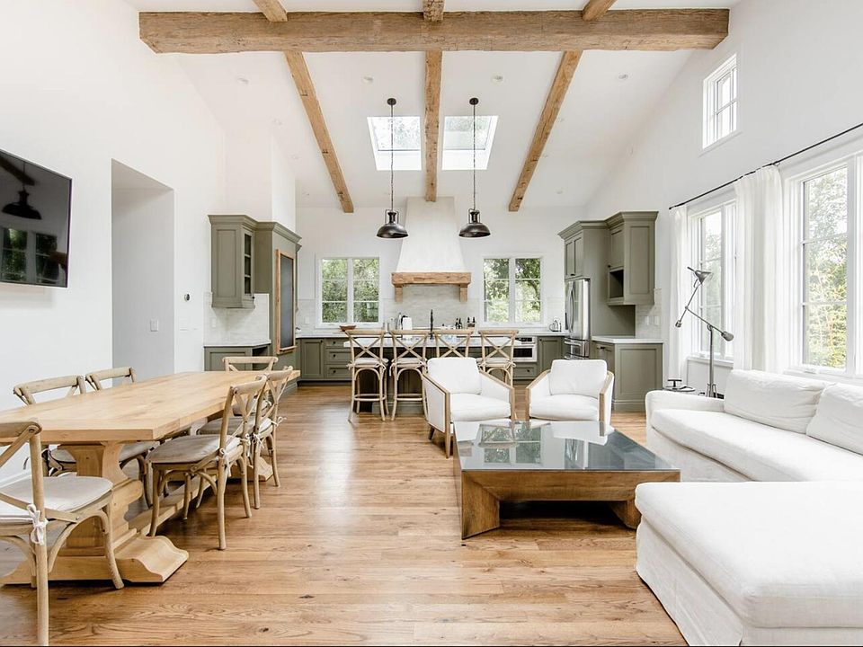 open living space with 17' vaulted ceiling, hand-hewn beams