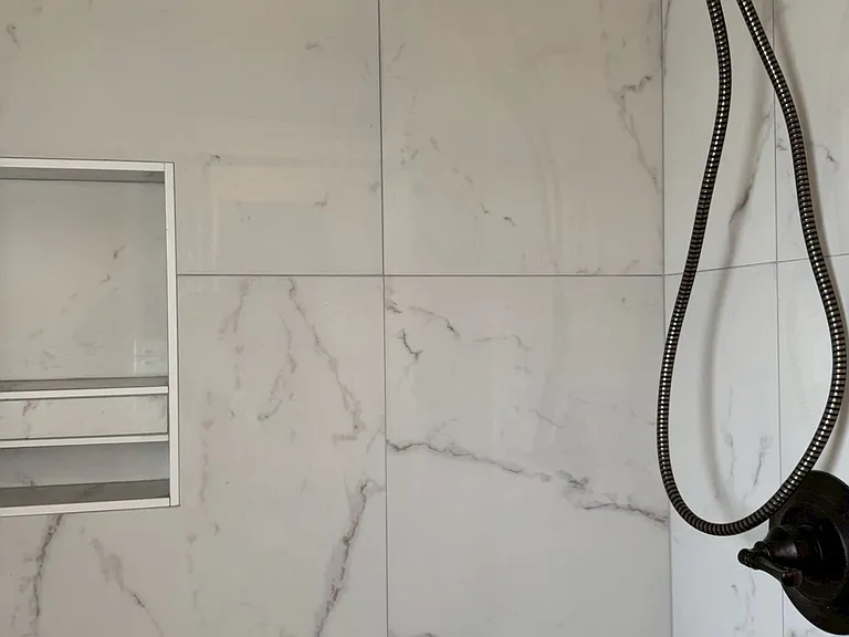 __ Primary Bathroom
"Beautifully remodeled bathroom featuring a walk-in tile shower, modern fixtures, and fresh finishes."