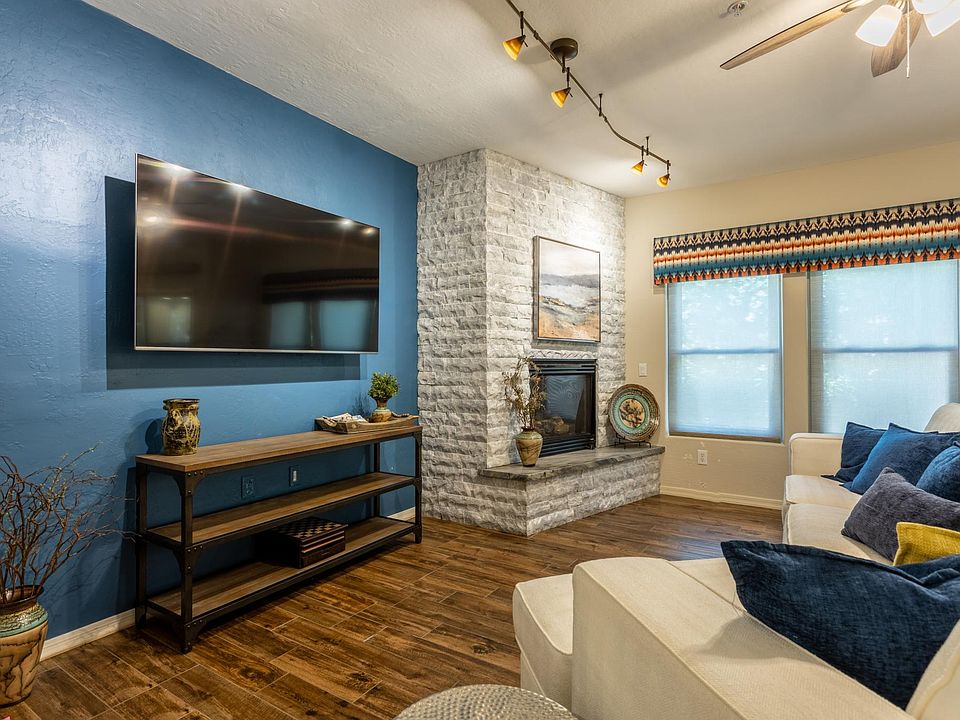 Great room with gas fireplace, comfortable seating and lovely views