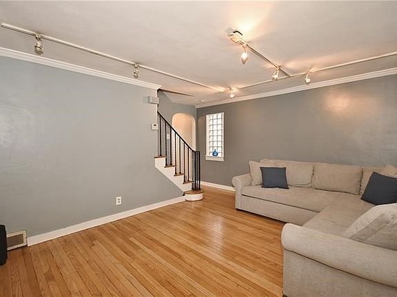 Spacious living room with track lighting