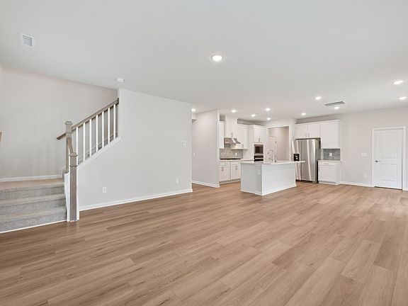 Great room in the Brentwood floorplan at a Meritage Homes community in Garner, NC.