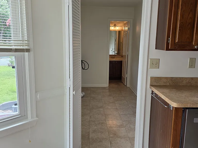Laundry room and half bath off of kitchen