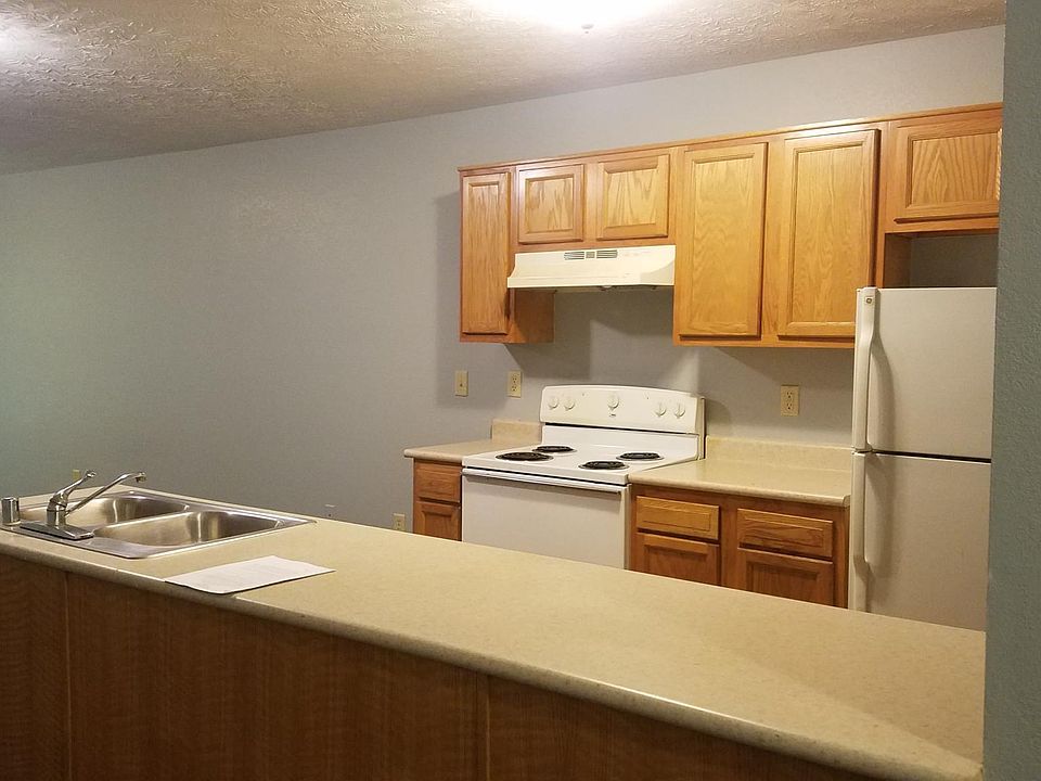 Kitchen with stove, refrigerator, and dishwasher.
