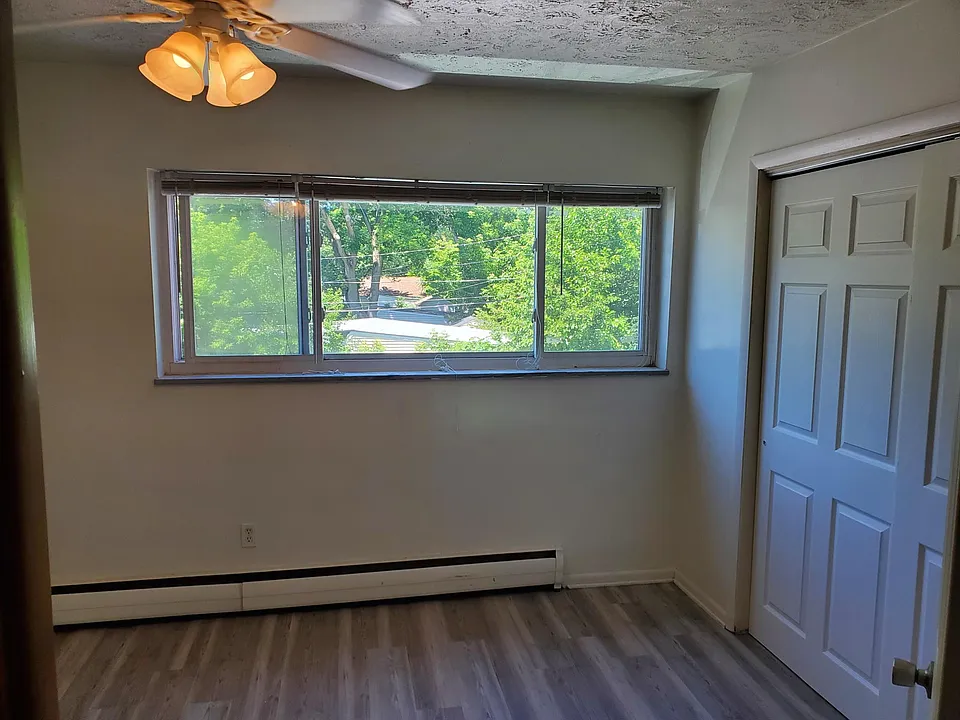 Large bedroom overlooking back parking lot