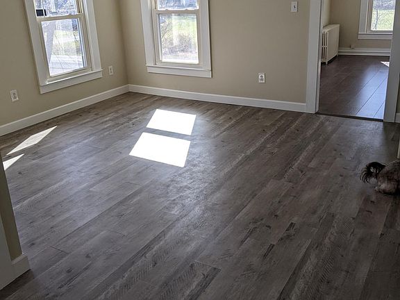 Dining room with new flooring and fan with light