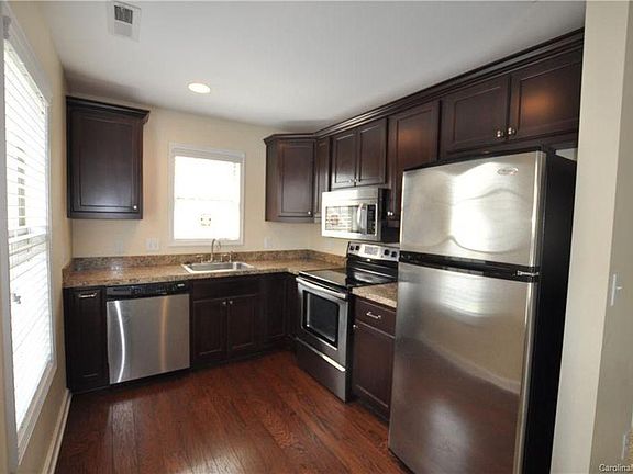 Kitchen with all updated appliances - dishwasher - disposal - full refrigerator - gas stove.