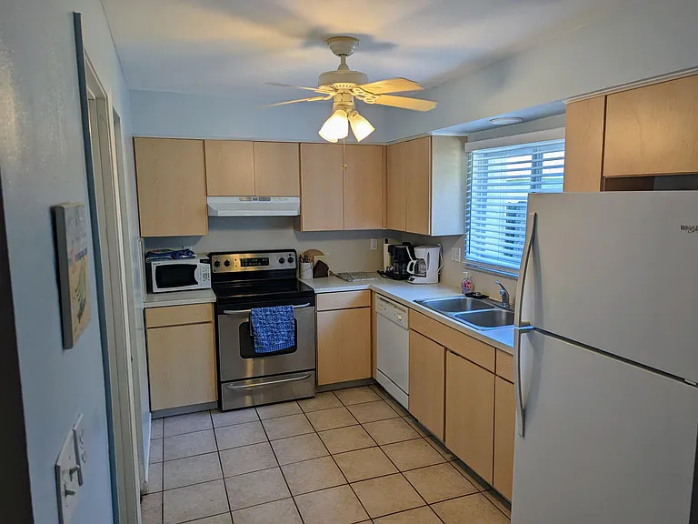 Kitchen - Fully equipped and stocked with dinnerware and cooking utensils