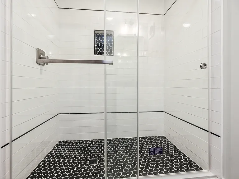 Large custom tiled shower.
