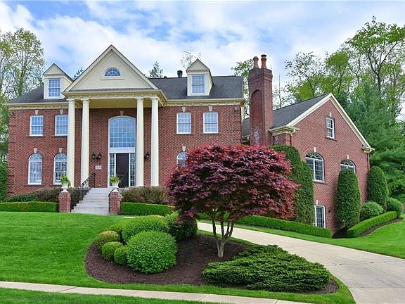Exterior Front - Governor's drive, 3-car garage, located on a 1-acre lot in Fox Chase.
