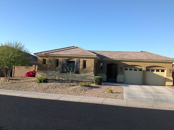 Front of home: 3 car garage and private gated courtyard