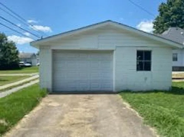 Side of garage with driveway