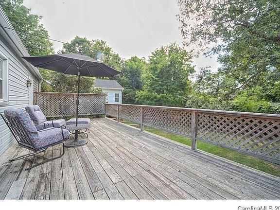 Fenced yard with large deck 