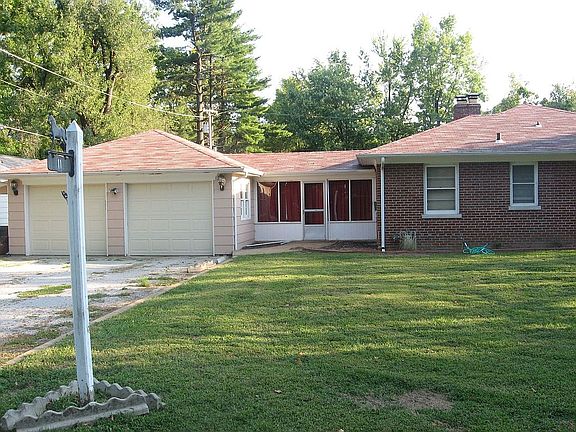 2 car garage with work area and toilet
