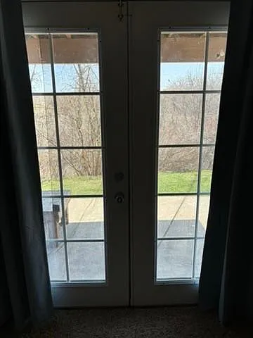 French doors to patio and creek