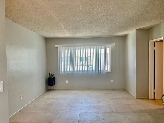 Living Room a lot of natural light. approx 13.5' ft wide X 14'ft length