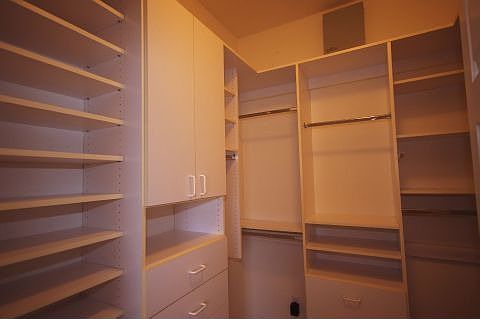 Master closet has lots of built-ins.