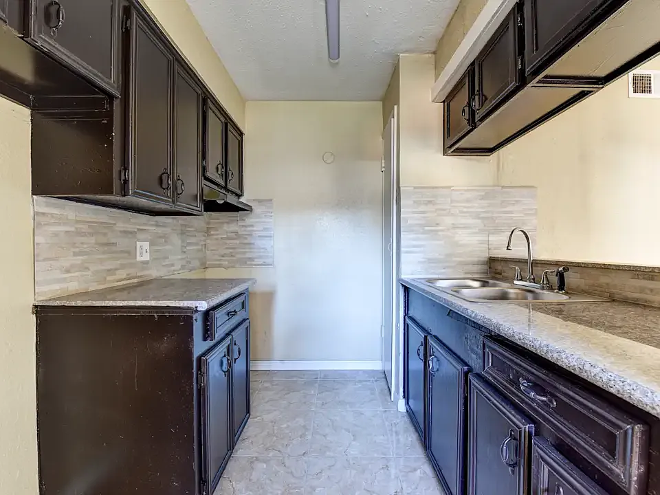 Nice granite countertops with splash in kitchen area