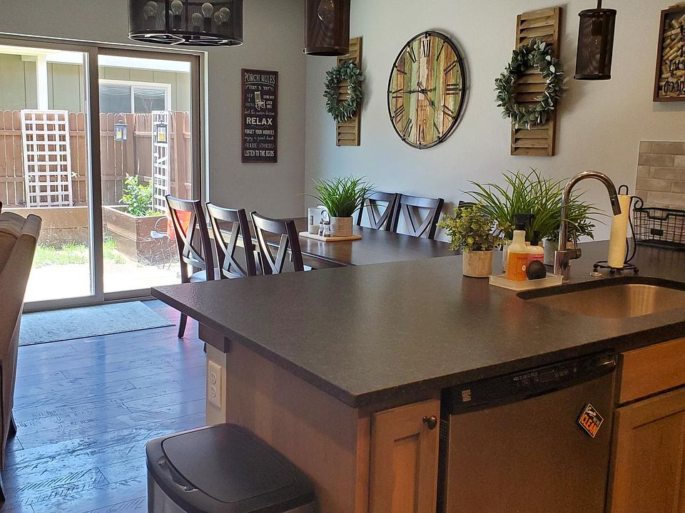 Kitchen looking into dining room and back yard