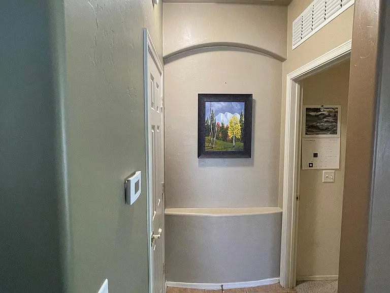 Entry from Living room to master bedroom

Storage closet for coats on the left