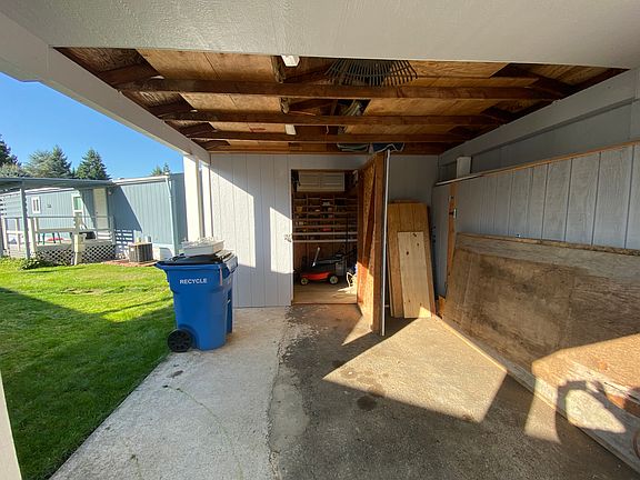 under carport facing Shed