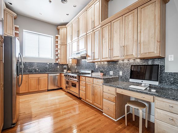 Viking stove (2 ovens) granite countertops and built in granite desk.
Ample cabinetry storage.
