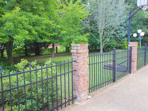 Iron & Brick fenced yard