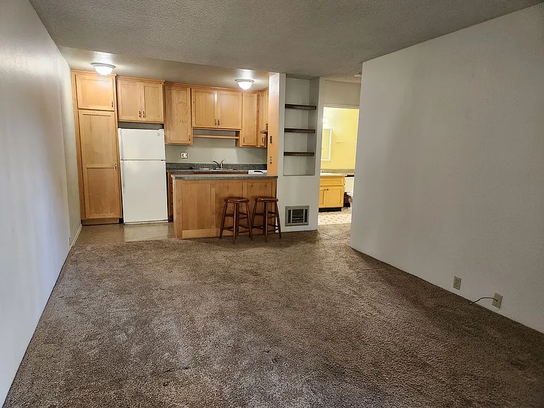 LR facing kitchen.