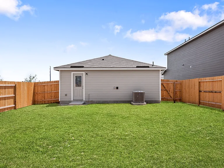 Spacious fenced-in back yard.