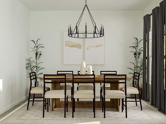 The formal dining room makes a great first impression on guests as they enter the home.