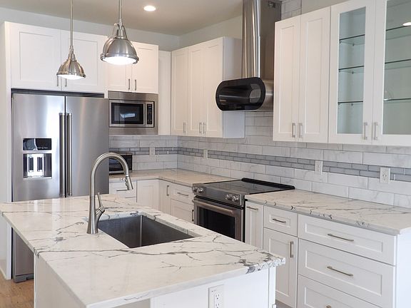 Open kitchen concept with refrigerator included!