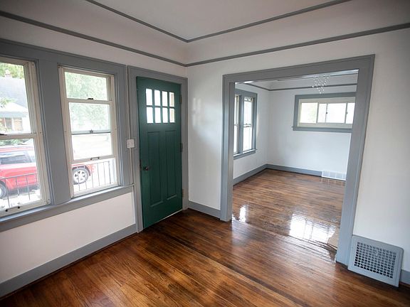 living room looking into dining room and out front windows