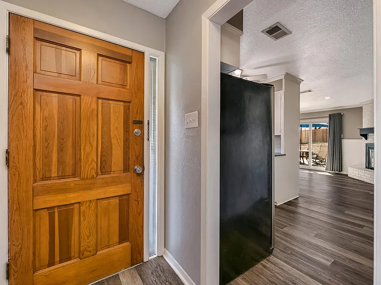 Front door and doorway to the kitchen