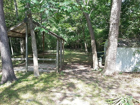 Backyard, metal shed on right
