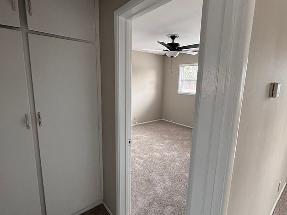 Split view of the hallway entrance from the living room and the first bedroom