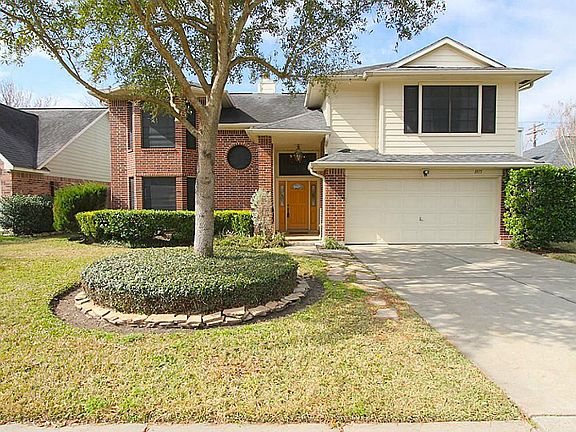 Beautiful curb appeal with mature landscaping.