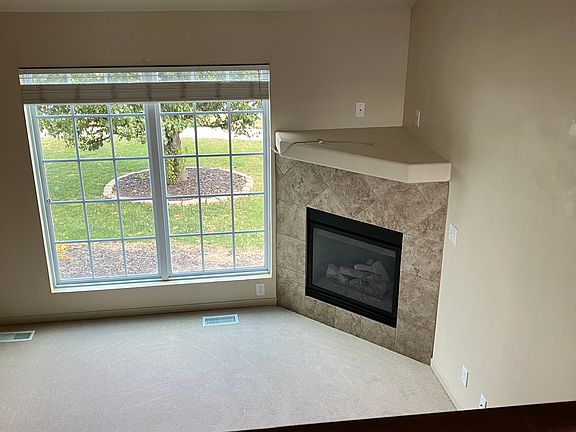 Living room fireplace from overlooking dining room