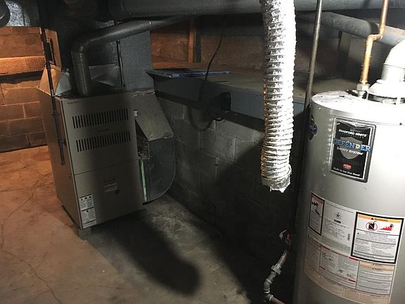 Crummy basement shot of furnace and water heater